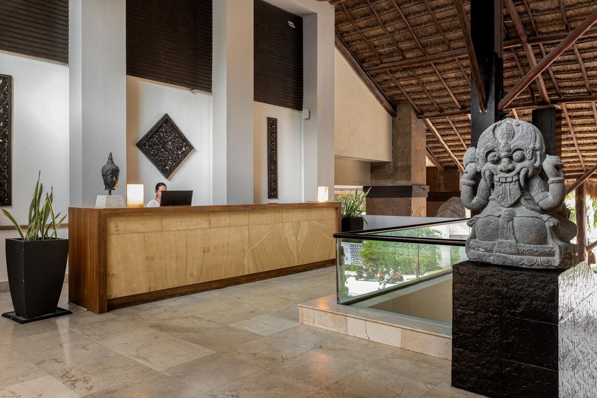 The reception desk and a carved stone guardian
